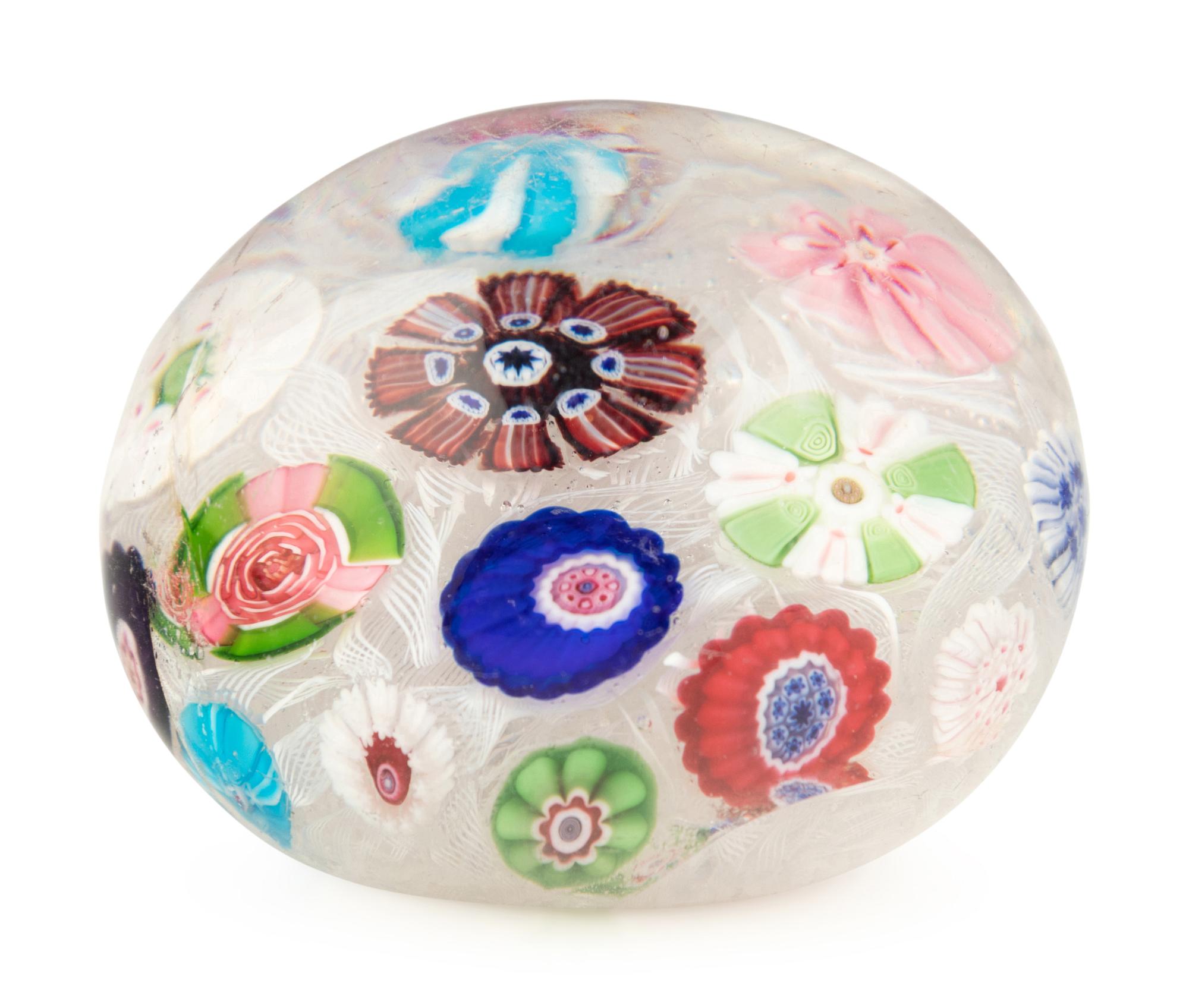 A Clichy Spaced Concentric Millefiori and Rose Cane on Upset Muslin Glass Paperweight
