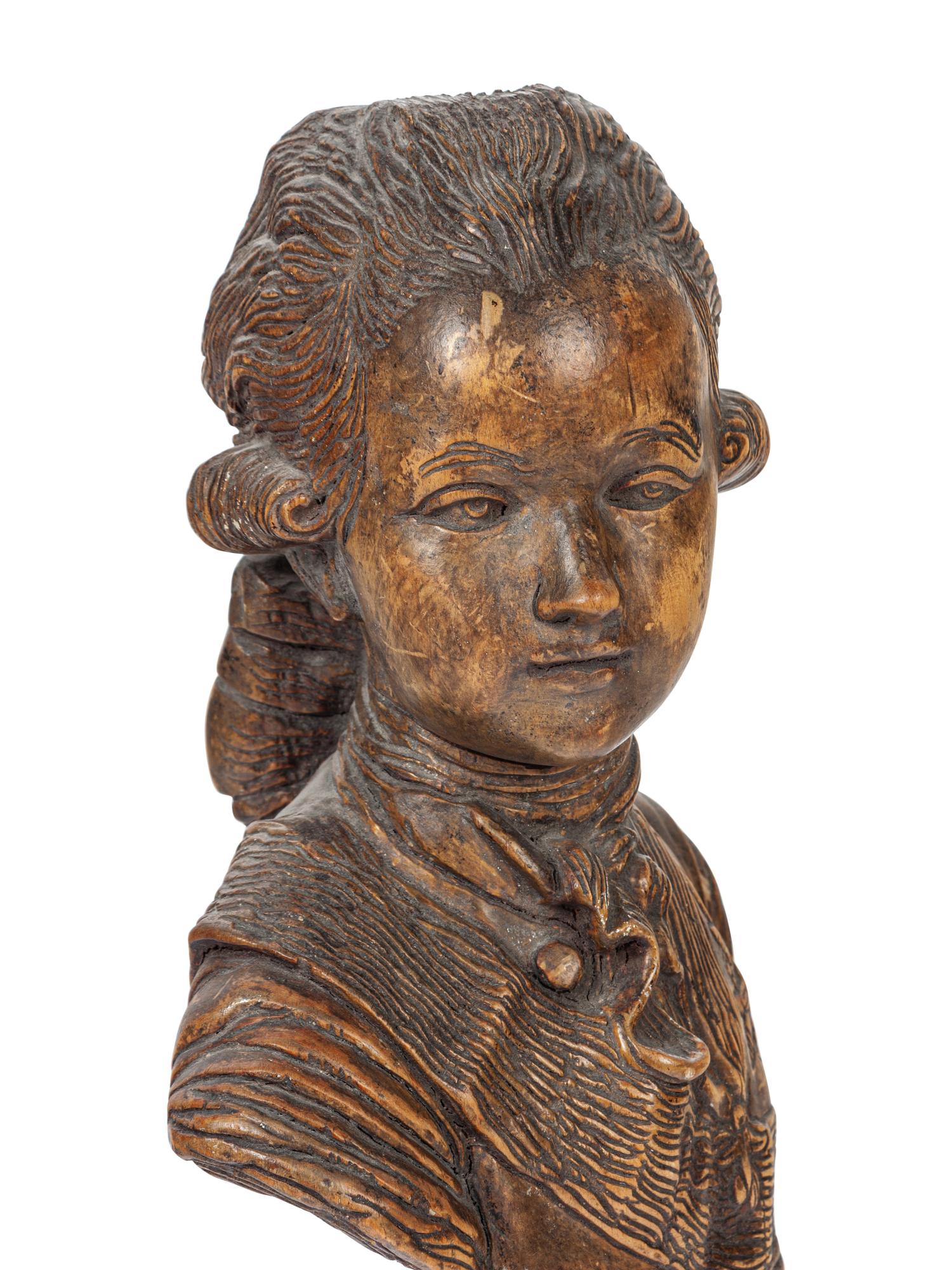A French Carved Fruitwood Bust of a Young Louis XVI