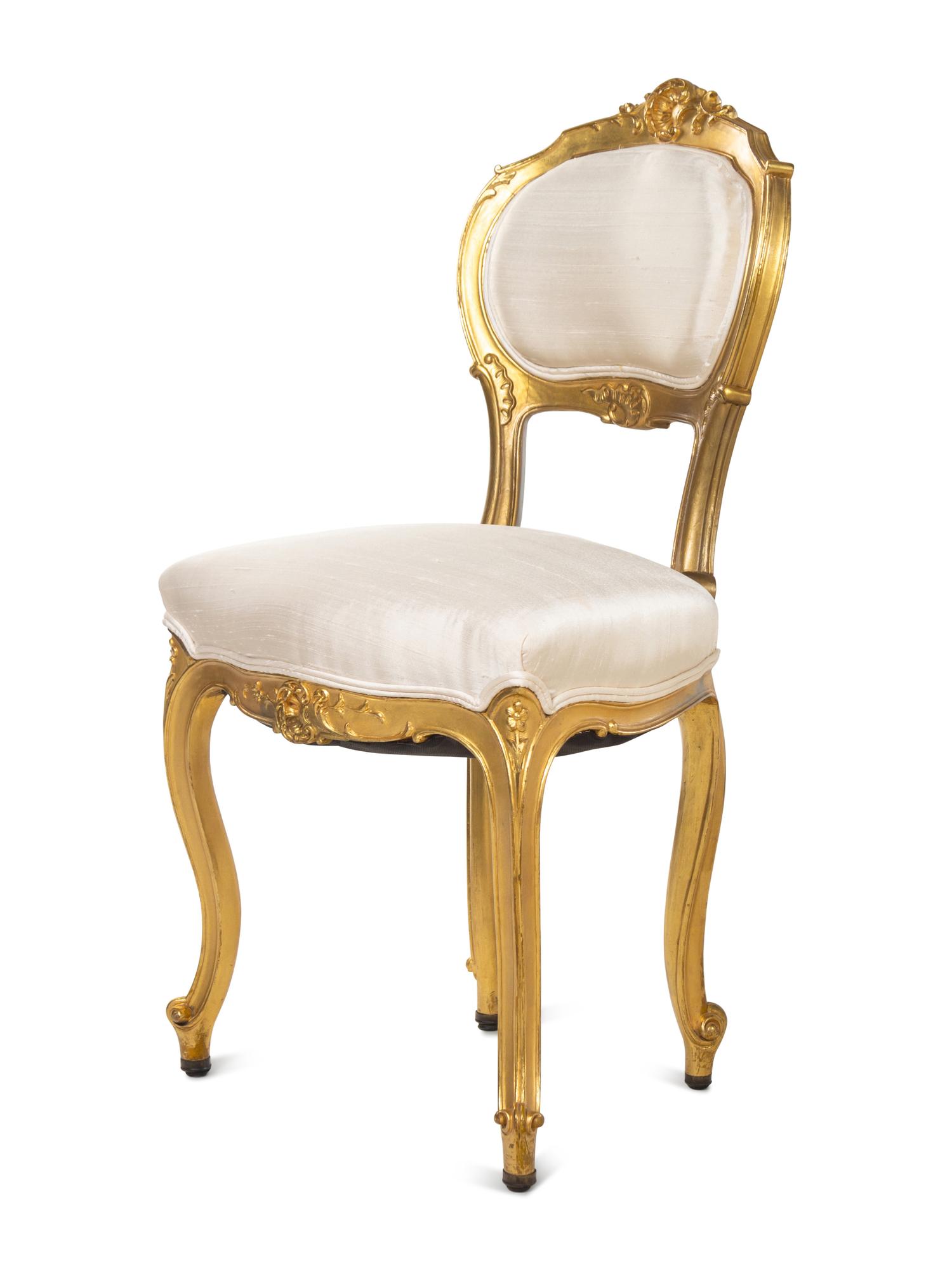 An Assembled Louis XV Style Giltwood Parlor Suite