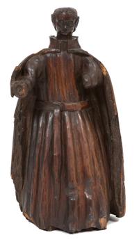 An Italian Carved Walnut Figure of a Clergyman Height 19 inches. — 17TH CENTURY