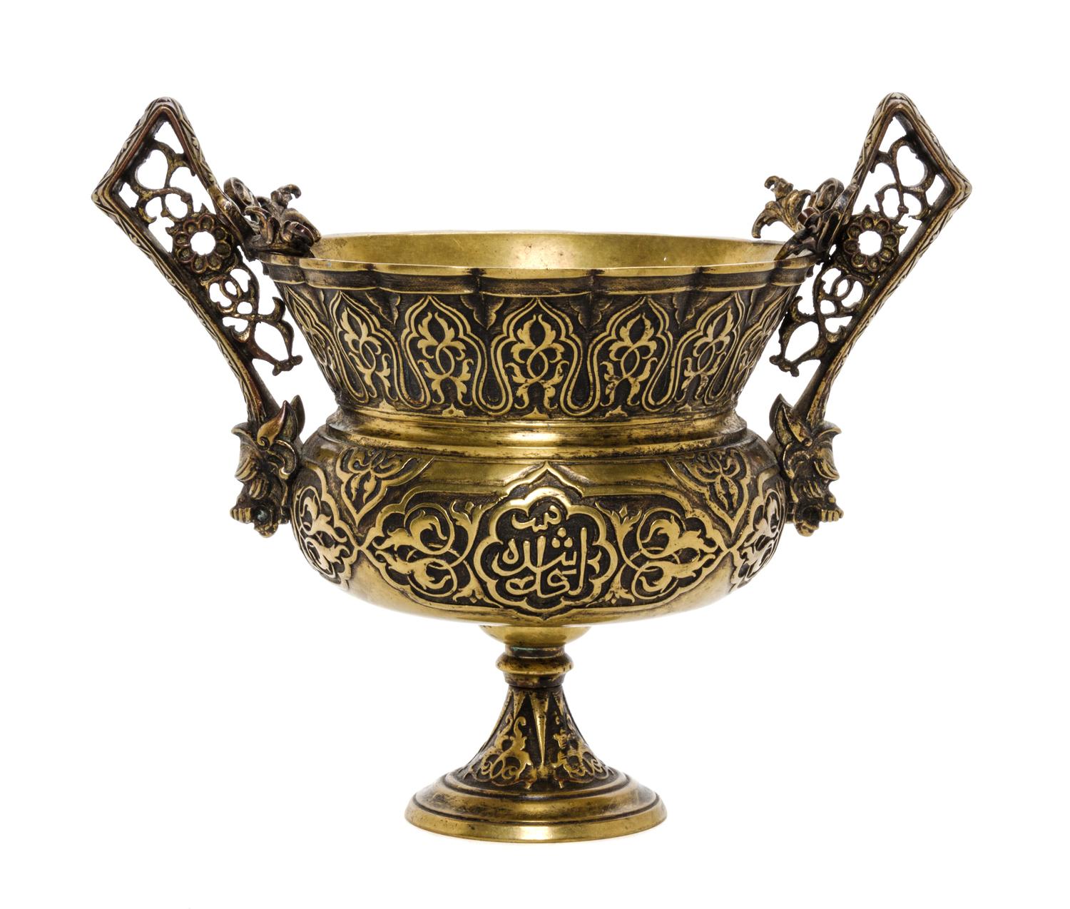 A Middle Eastern Bronze Urn, Height 6 inches.