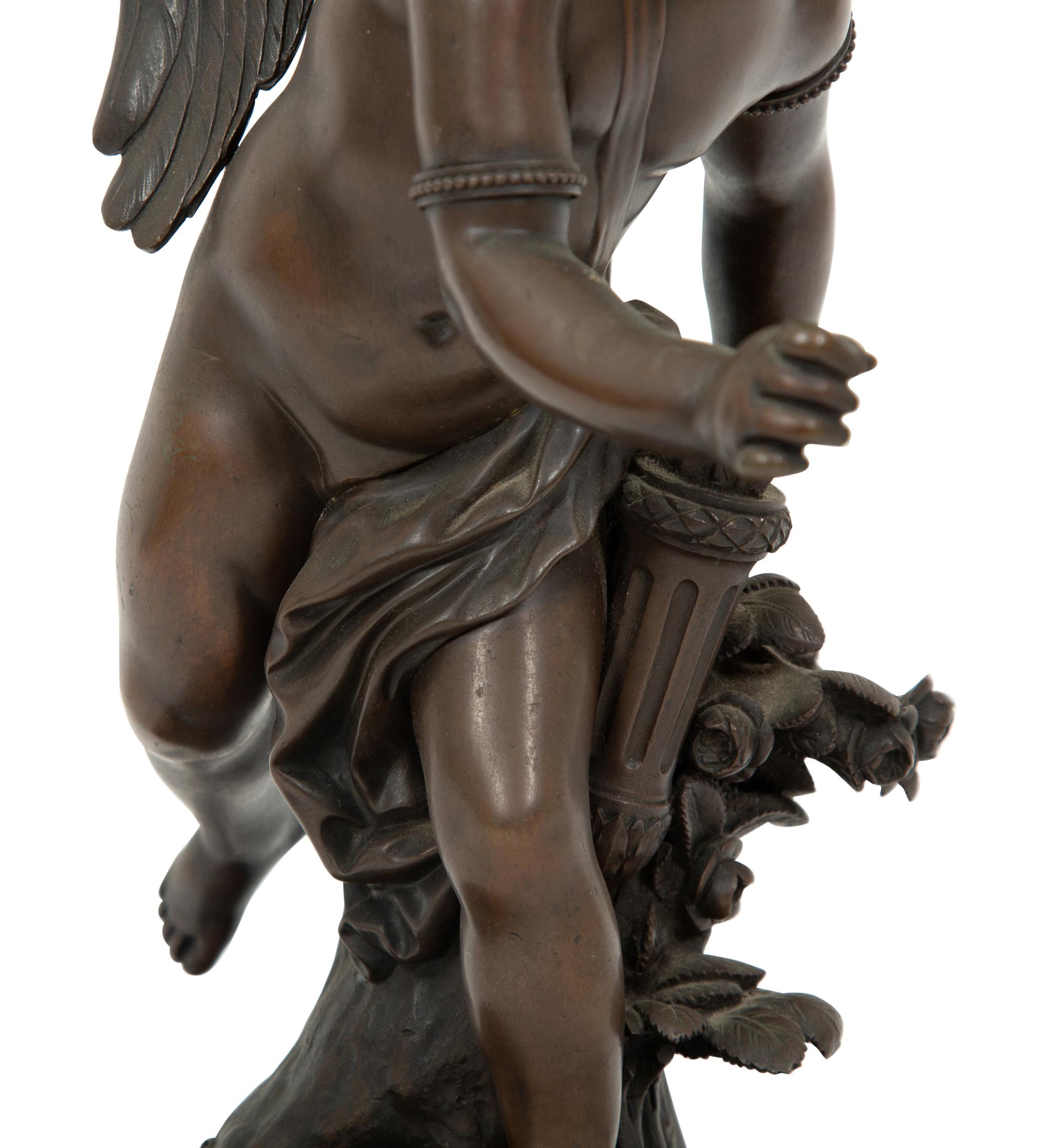 A French Bronze Figure of Eros on a Wood Base