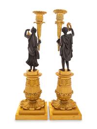A Pair of Charles X Style Gilt and Patinated Bronze Figural Candlesticks