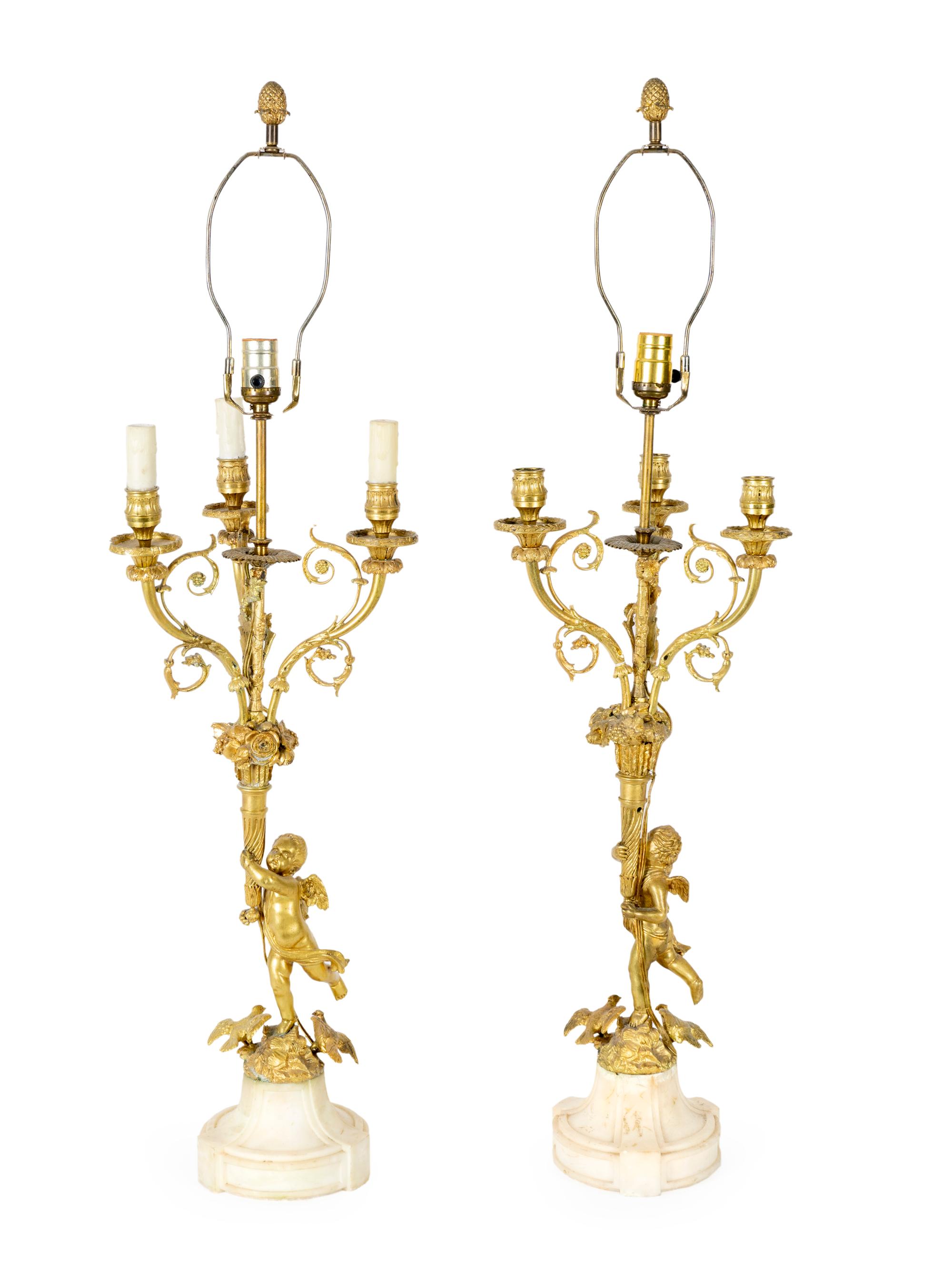 A Pair of Louis XVI Style Gilt Bronze Figural Lamps — EARLY 20TH CENTURY