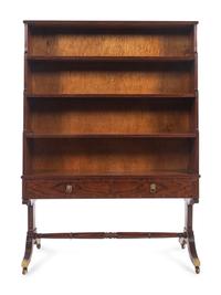 A Regency Style Figured Rosewood Double-Sided Bookcase on Stand