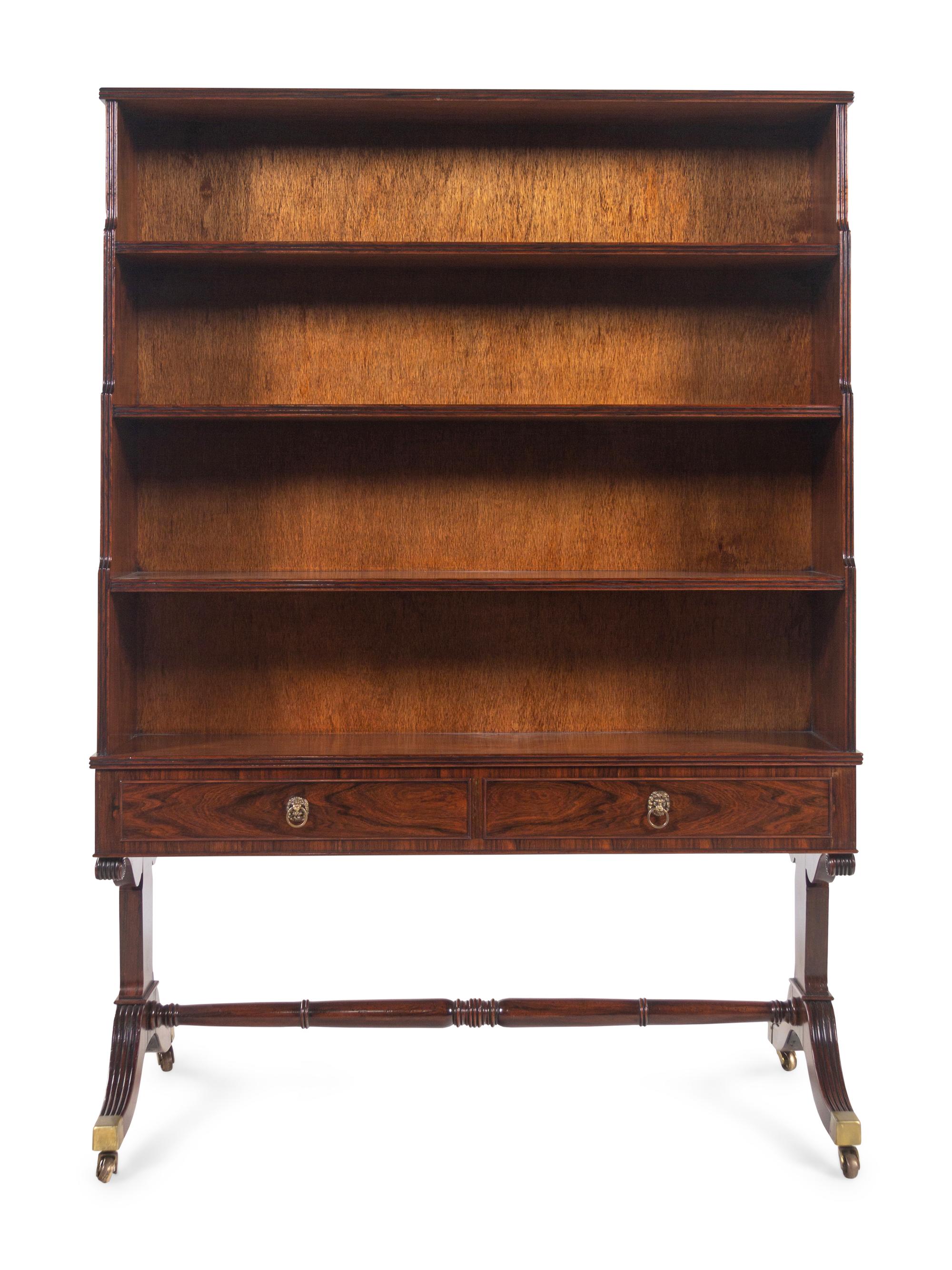 A Regency Style Figured Rosewood Double-Sided Bookcase on Stand