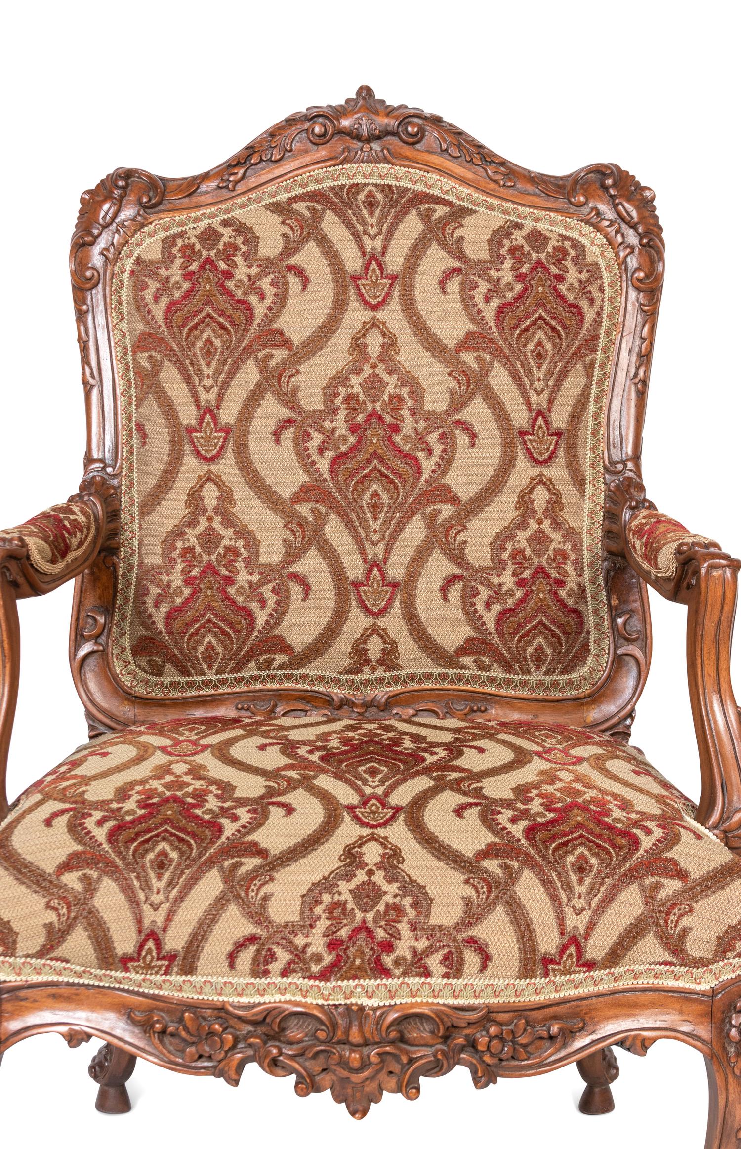 A Pair of Rococo Style Carved Walnut Armchairs