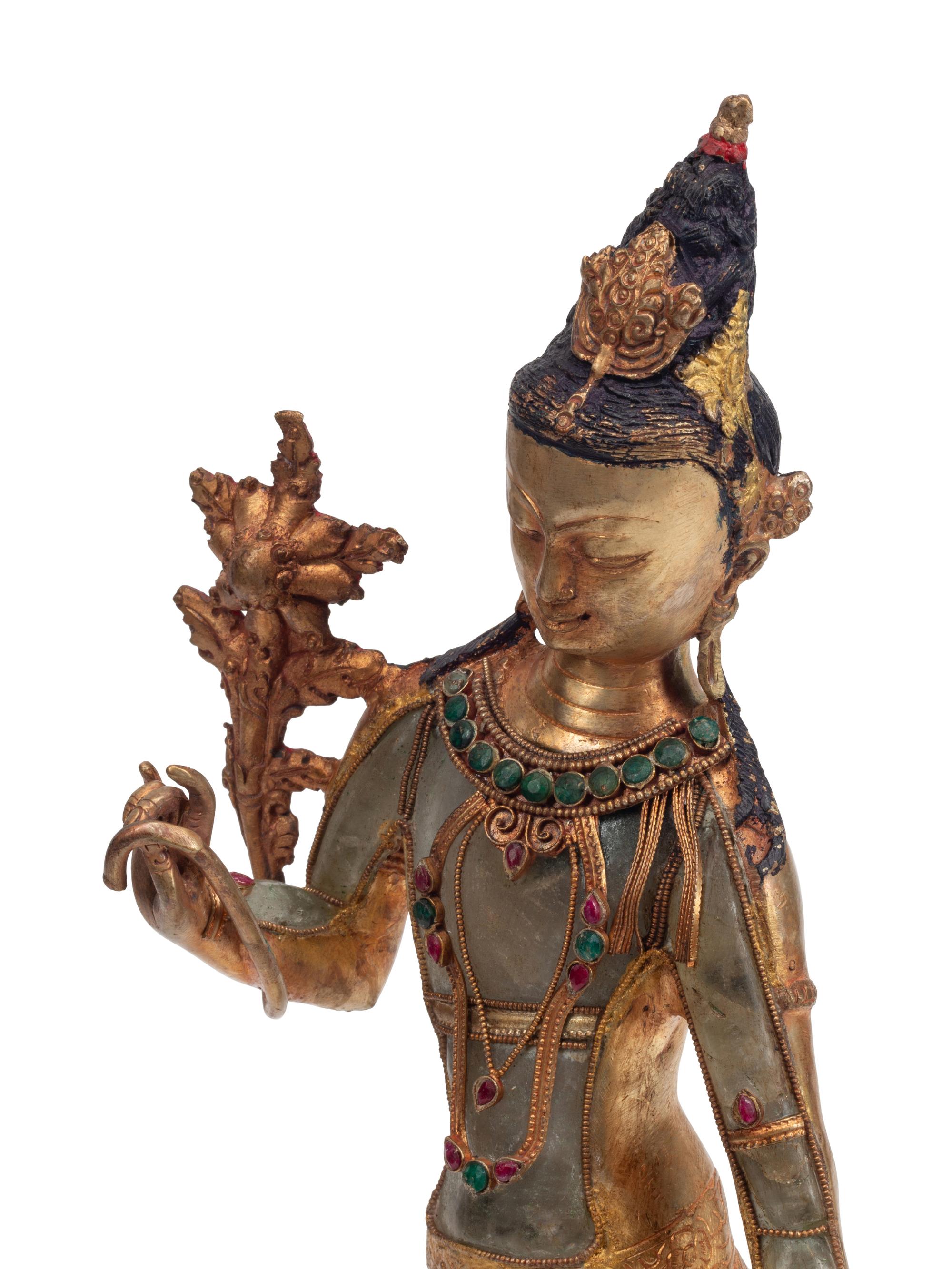 A Gilt Bronze and Rock Crystal Standing Deity
