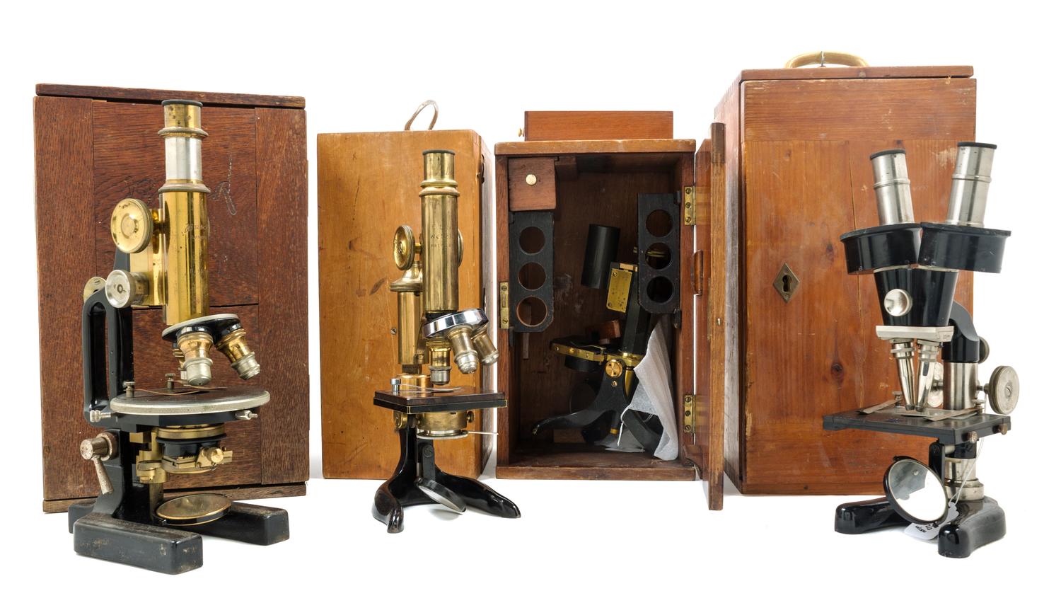 A Group of Four Back Lacquered Microscopes Height of tallest 11 inches. — VARIOUS MAKERS, EARLY 20TH CENTURY