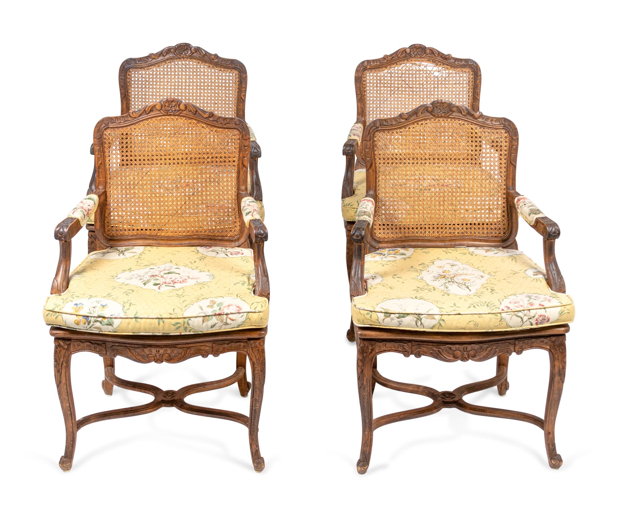 A Set of Four Louis XV Style Caned Oak Fauteuils