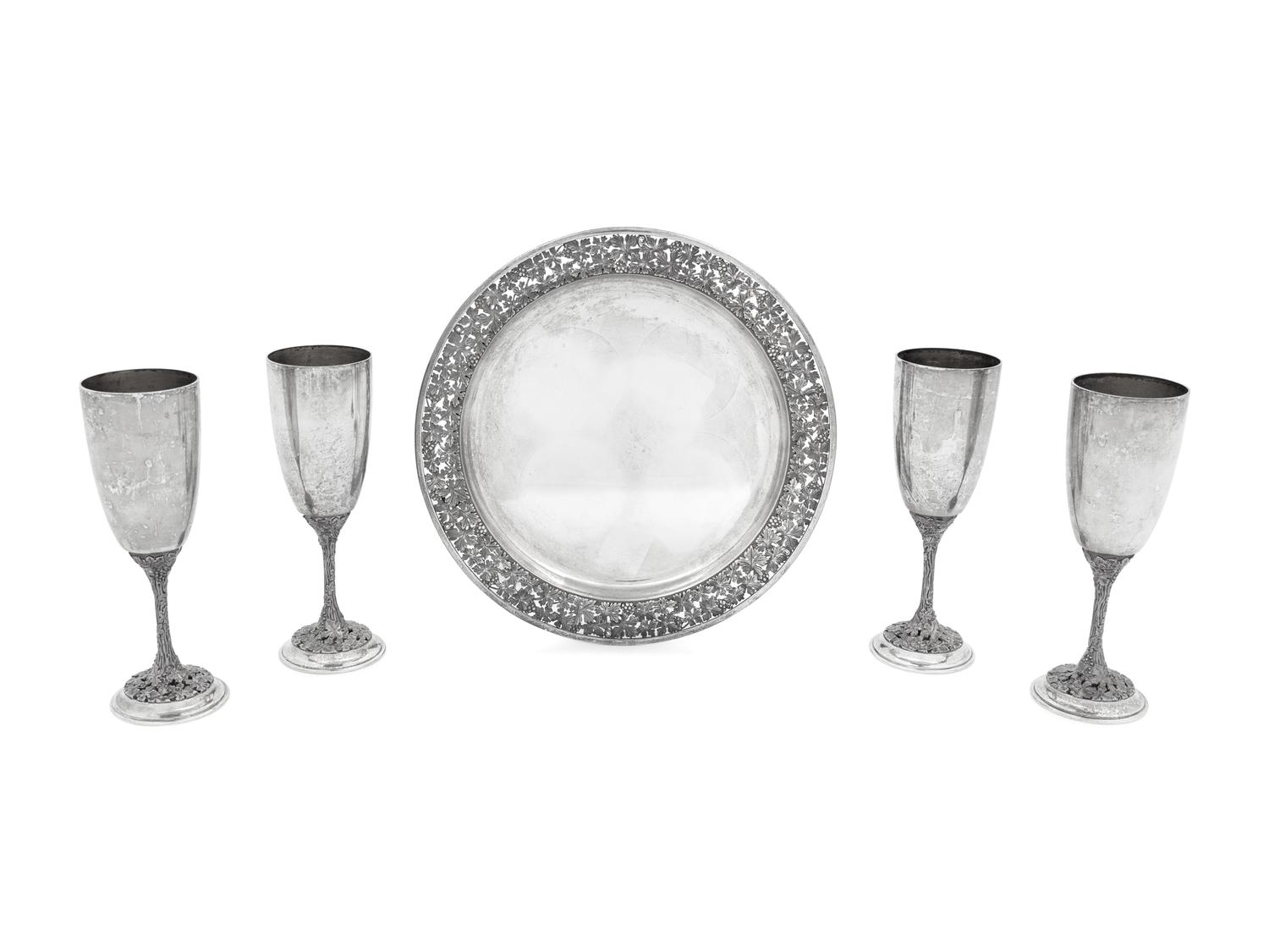 A Set of Four Asprey Silver Champagne Flutes and Tray