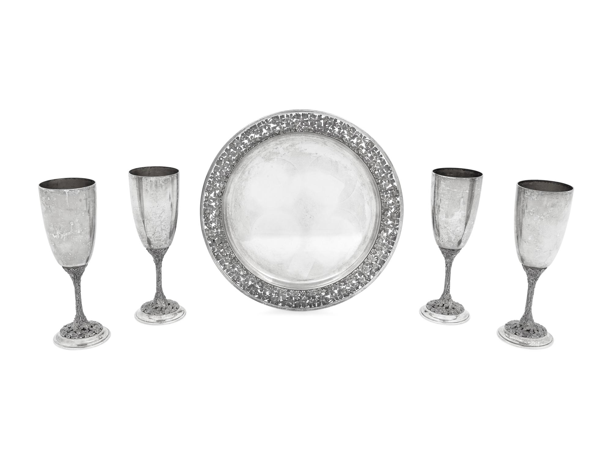 A Set of Four Asprey Silver Champagne Flutes and Tray