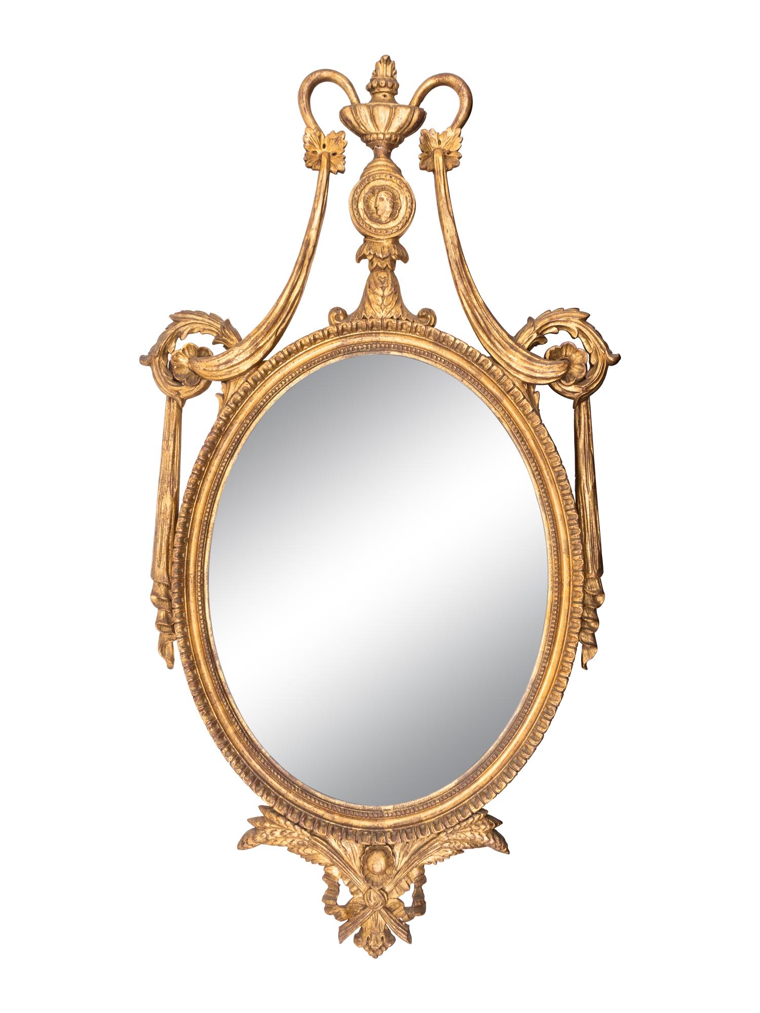 A Neoclassical Style Oval Giltwood Mirror — LATE 19TH CENTURY