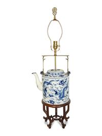 An Oversized Chinese Export Porcelain Teapot Mounted as a Lamp with a Wood Stand