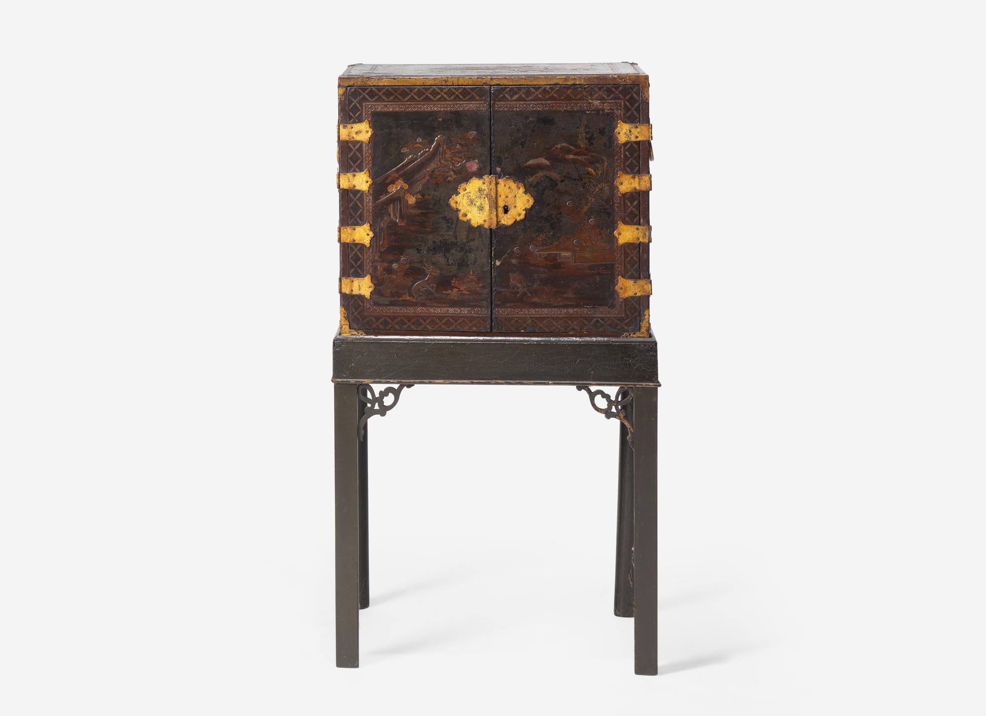A George III Parcel Gilt Japanned Cabinet on Stand