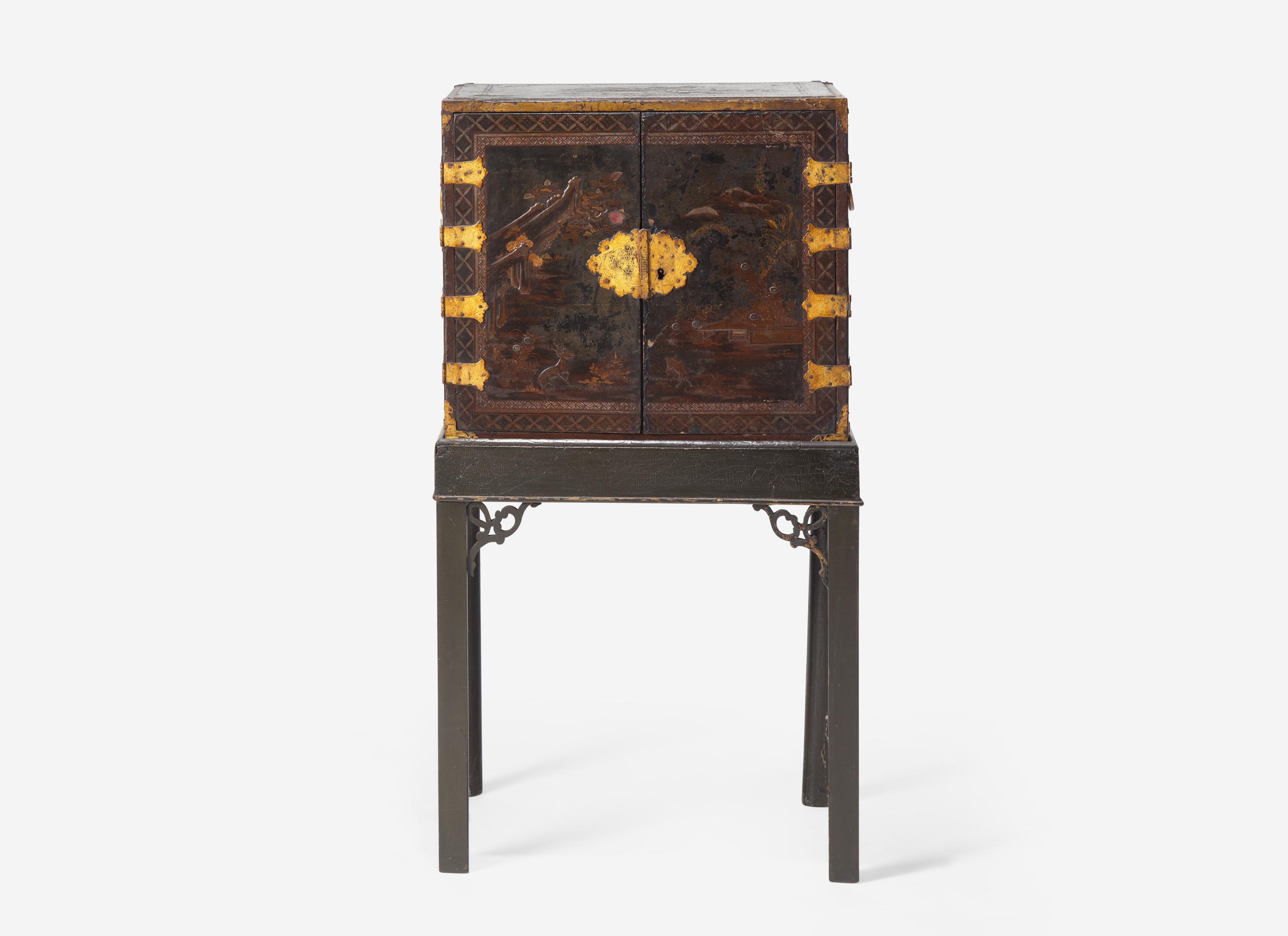 A George III Parcel Gilt Japanned Cabinet on Stand