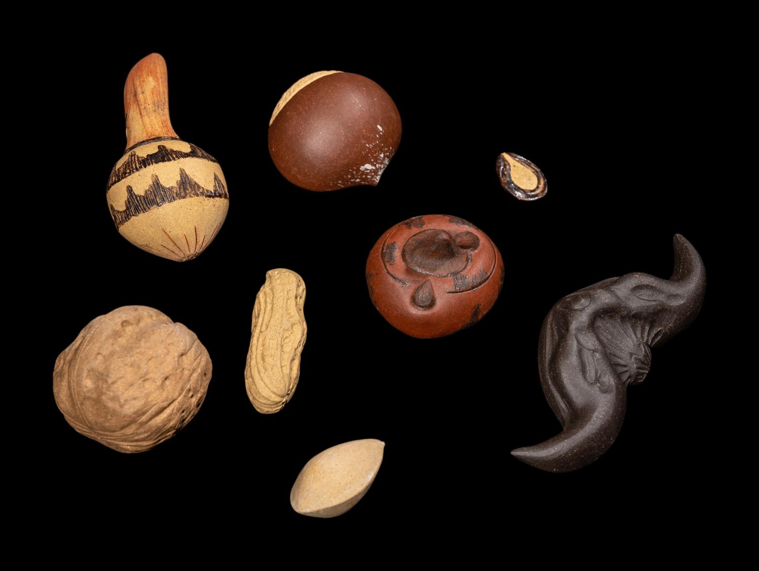 Eight Chinese Yixing Pottery Models of Fruits and Nuts