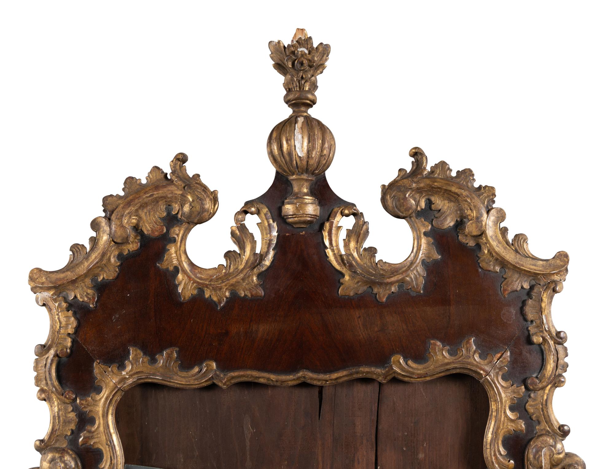 A George II Walnut and Parcel Gilt Mirror