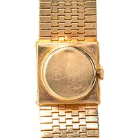 TRICOLOR GOLD AND EMERALD SURPRISE WATCH