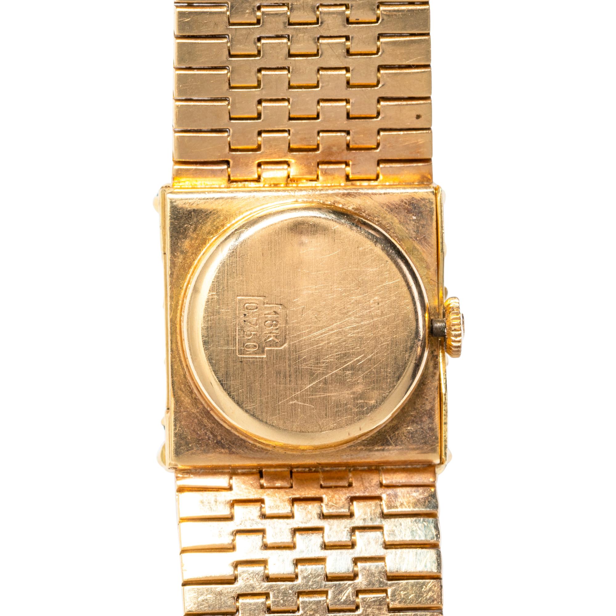 TRICOLOR GOLD AND EMERALD SURPRISE WATCH