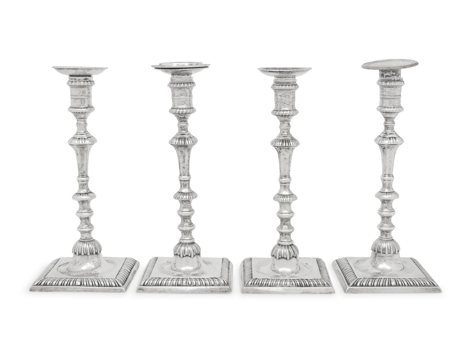 An Assembled Set of Four George III Silver Candlesticks