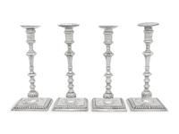 An Assembled Set of Four George III Silver Candlesticks