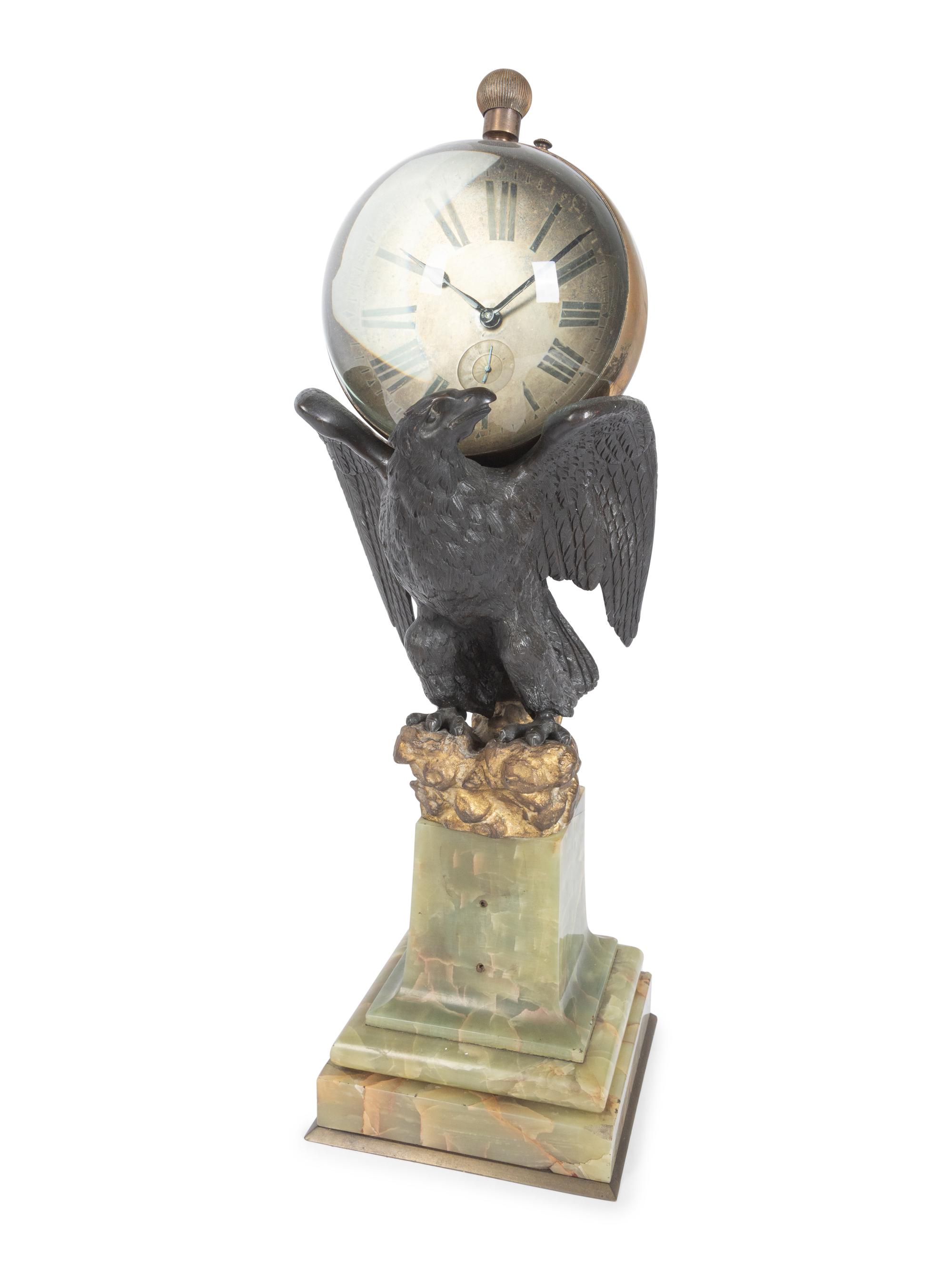 A Continental Gilt and Patinated Bronze and Onyx Clock