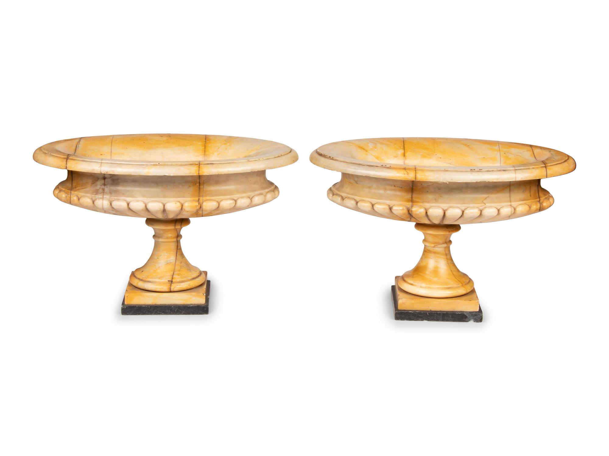 A Pair of Neoclassical Style Gadrooned Sienna Marble Urns