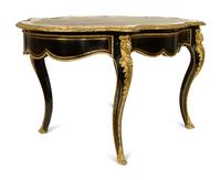 A Napoleon III Style Gilt Bronze Mounted Ebonized Writing Table — LATE 19TH CENTURY
