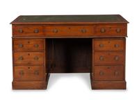 A George IV Walnut Kneehole Desk with Green Leather Inset Top