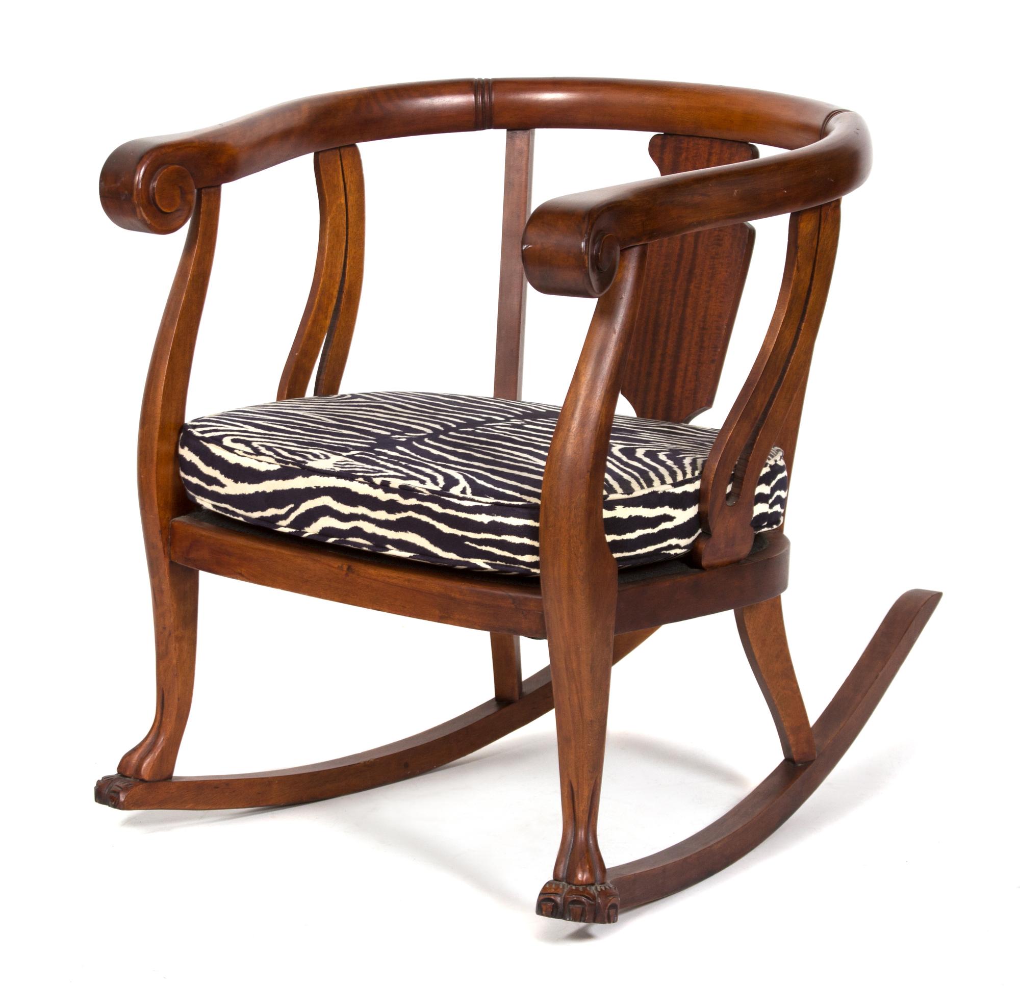 A British Colonial Mahogany Loveseat and Barrel-Back Rocking Chair Height of loveseat 32 x width 45 x depth 23 inches. — 20TH CENTURY