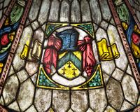 A Large Renaissance Revival Bronze Table Lamp with Stained Glass Shade