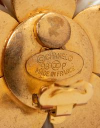 Four Chanel Accessories: Three Ear Clips & One Camellia Pin, 1980-90s