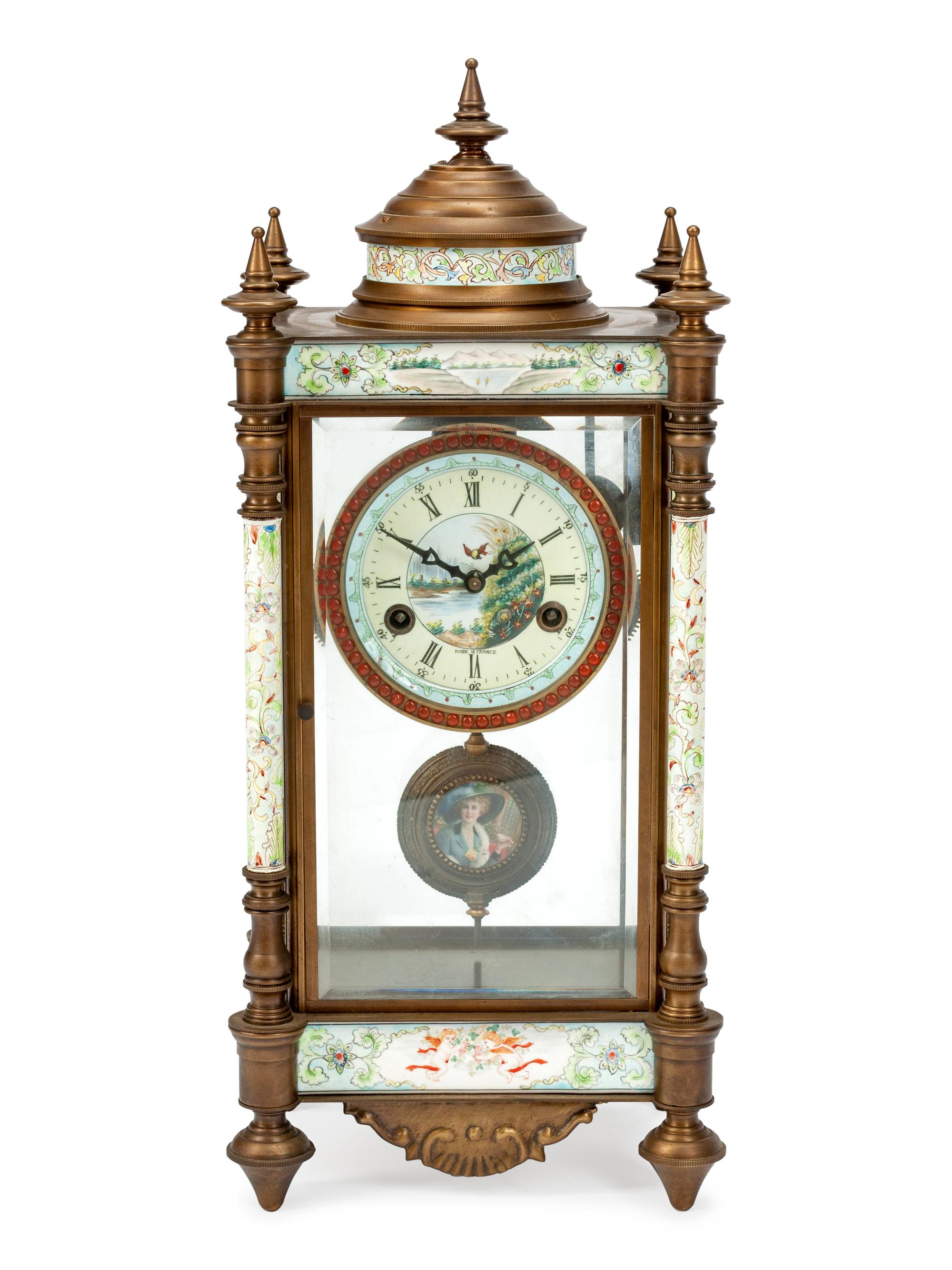 A Louis XVI Style Patinated Bronze Clock