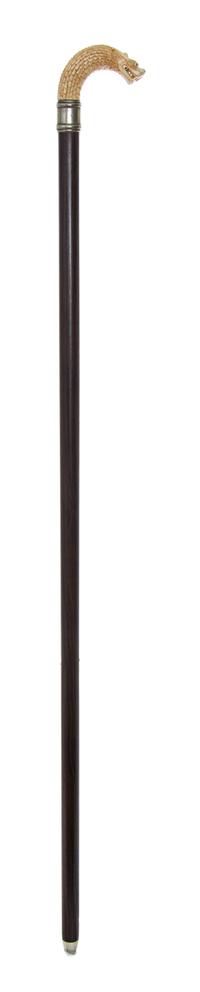 A Chinese Ivory Handled Cane, Length of handle 4 1/2 x length overall 35 inches.