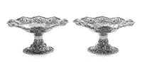 A Pair of American Silver Compotes, S. Kirk & Son, Baltimore, MD, each rim worked to show rocaille and S-scrolls enclosing the floral a