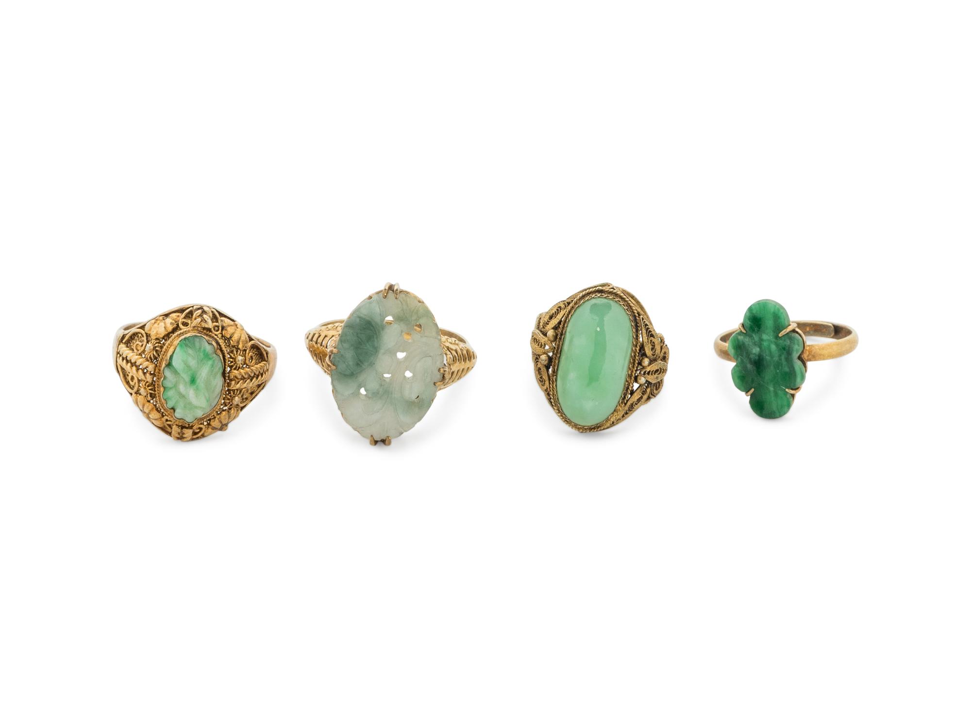 Four Chinese Silver-Gilt Mounted Jadeite Rings