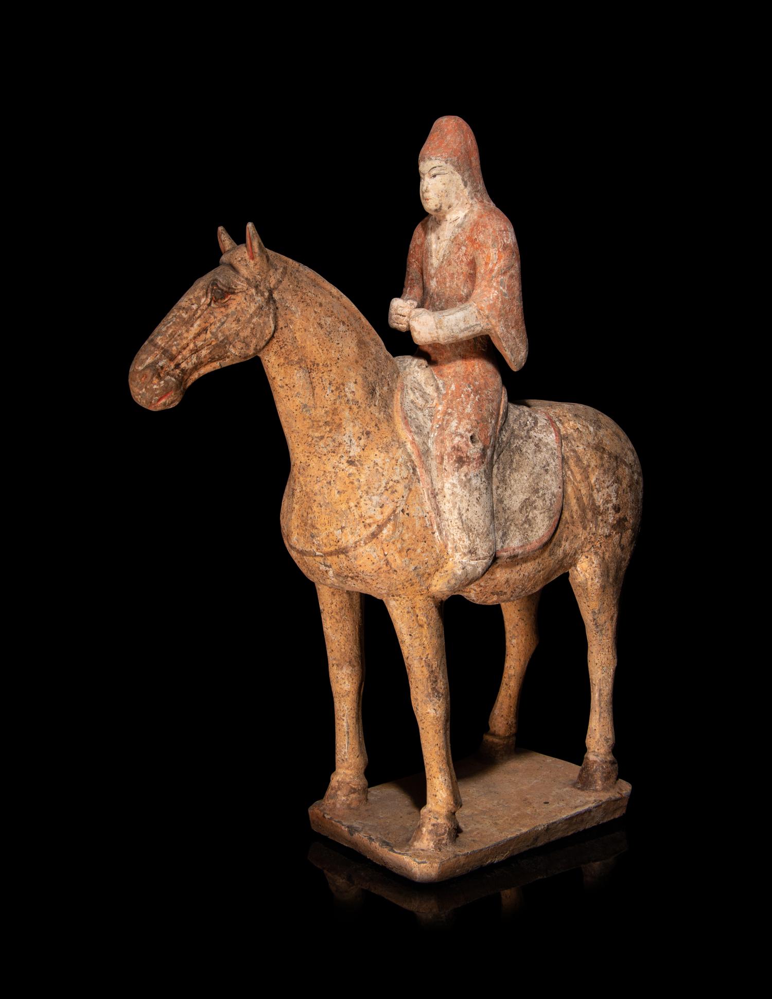 A Pair of Painted Pottery Equestrian Figures