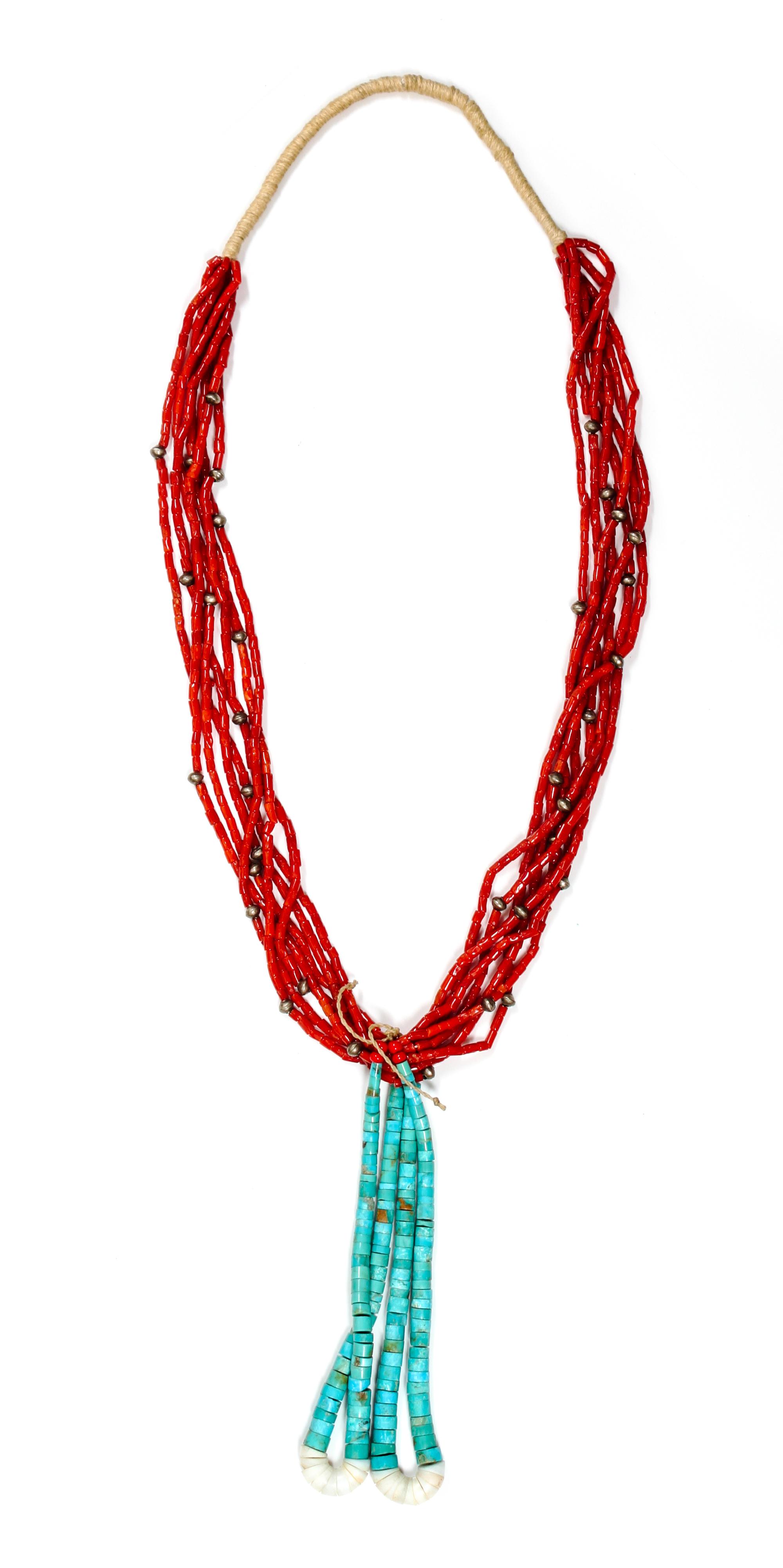 A Navajo Seven Strand Coral Necklace Length of necklace 28 inches; jocla 6 inches.