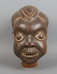 A Carved Helmet Mask, Bamum Height 13 inches.