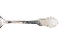 [WESTERN AMERICANA]. A group of 2 Henry Bohm silver banquet spoons commissioned by railroad magnate Otto Mears and featuring detailed mining scenes, ca 1890s.