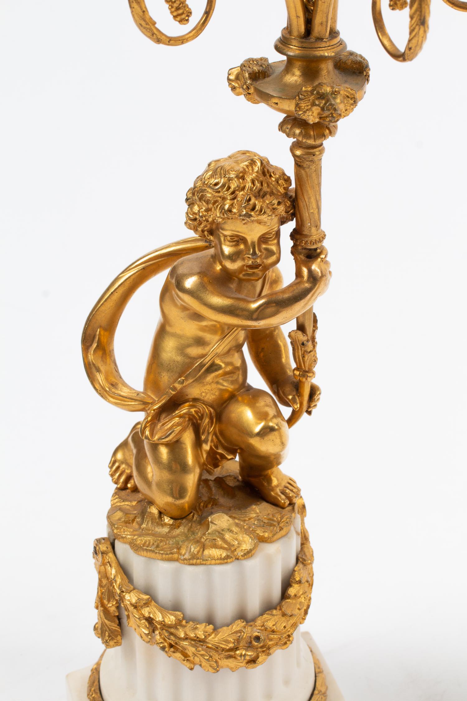 A Pair of Louis XVI Style Gilt Bronze and Marble Figural Candelabra