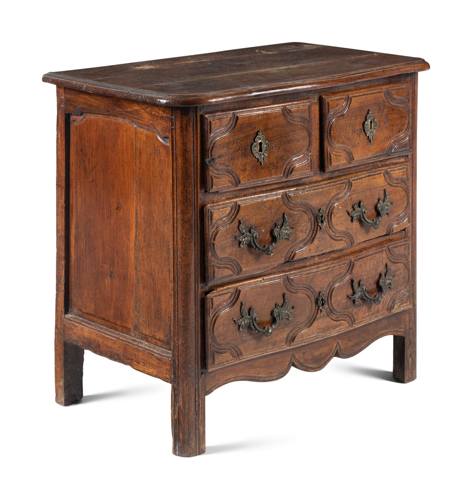 A Louis XV/XVI Provincial Walnut Chest of Drawers