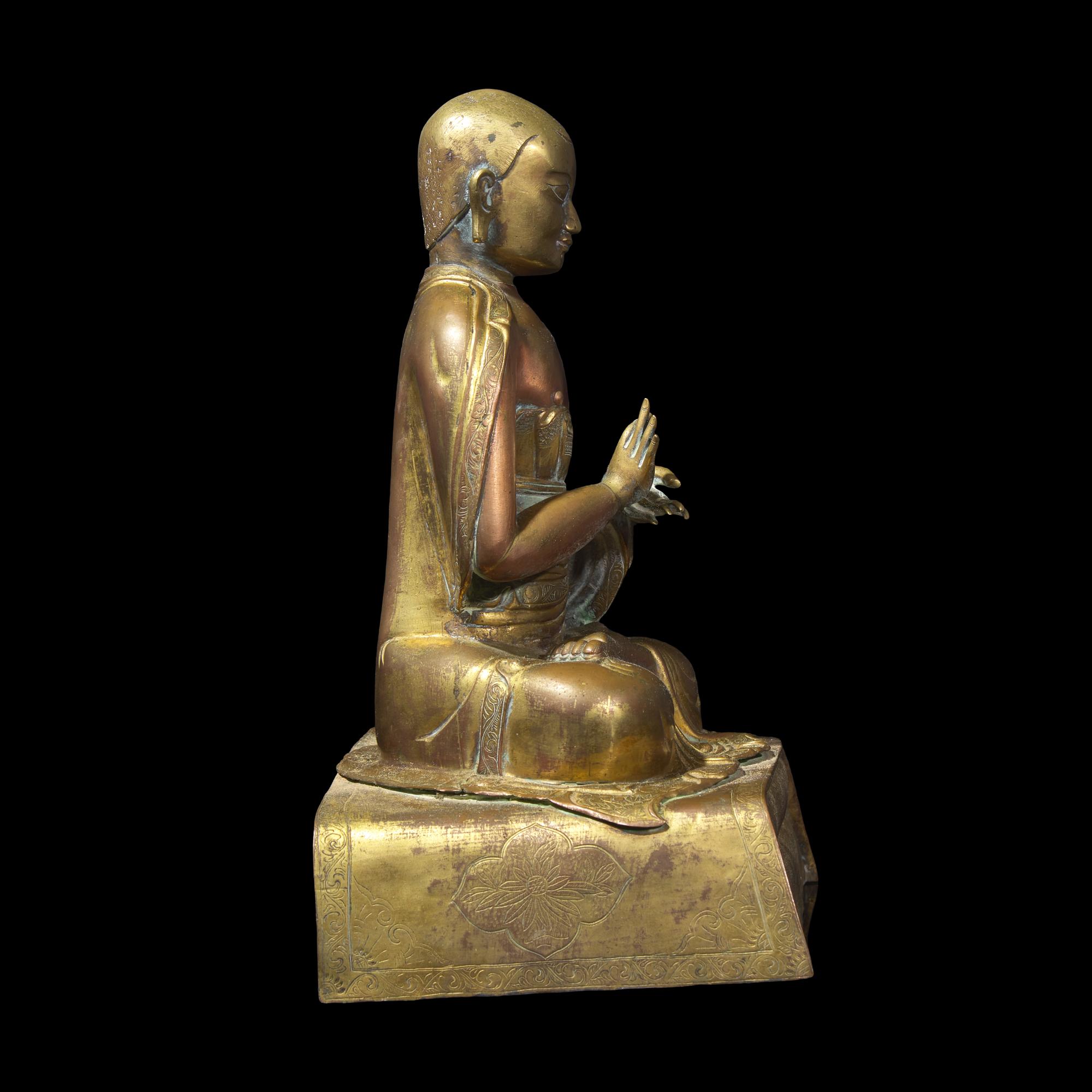 A Gilt Repousse Copper Alloy Figure of a Seated Monk, Probably Dolonor, Inner Mongolia, 18th/19th Century 清中期 銅鎏金上師坐像