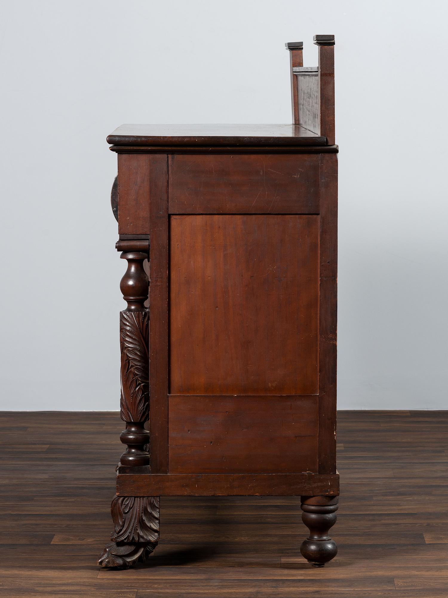 AWAITING DONATION - A Classical Carved and Stained Cherrywood Sideboard