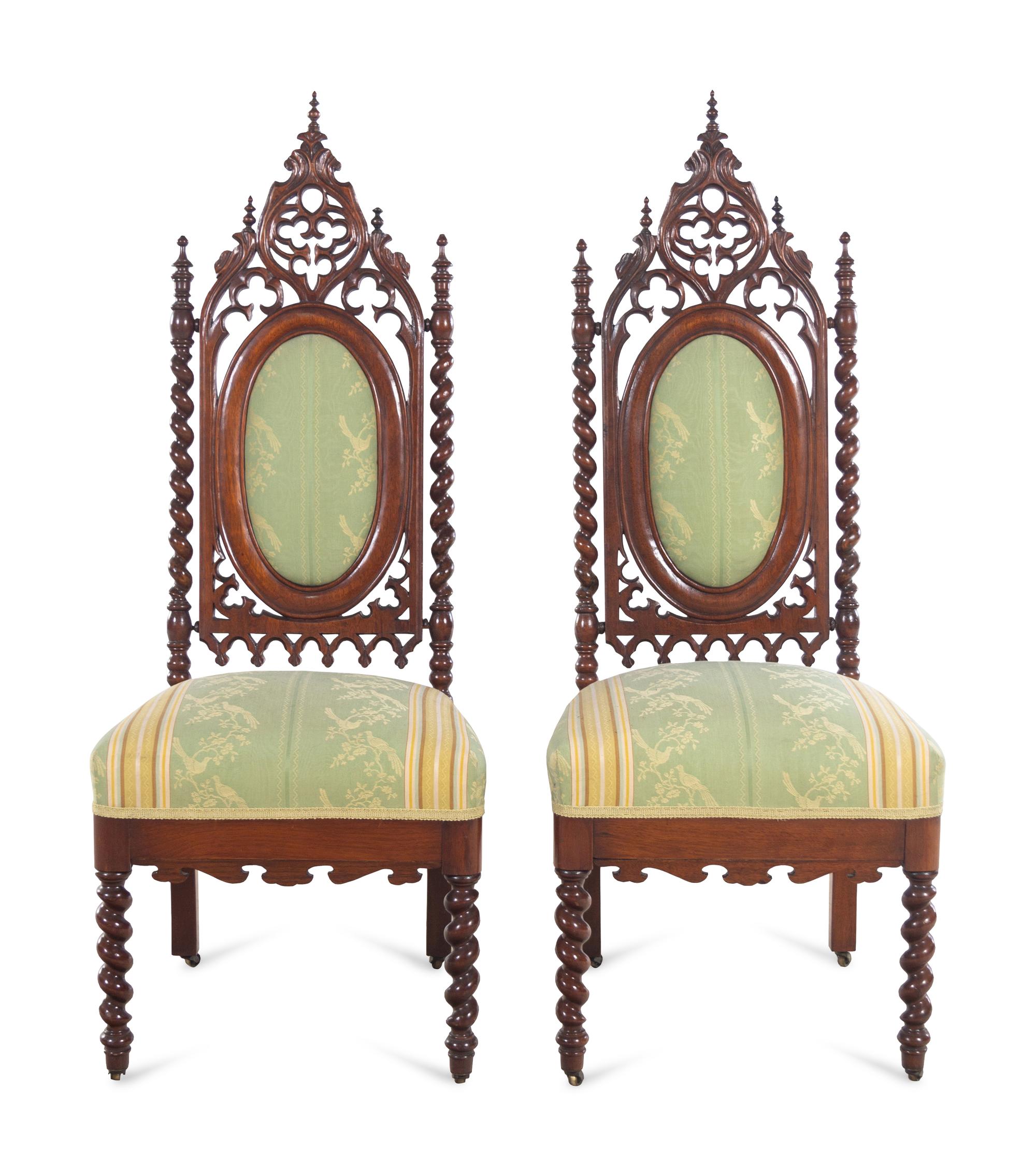 A Pair of Gothic Revival Carved Walnut Side Chairs