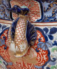 A Japanese Porcelain Jardinière and Pedestal