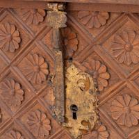 A Spanish Carved Walnut and Gilt Iron Chest