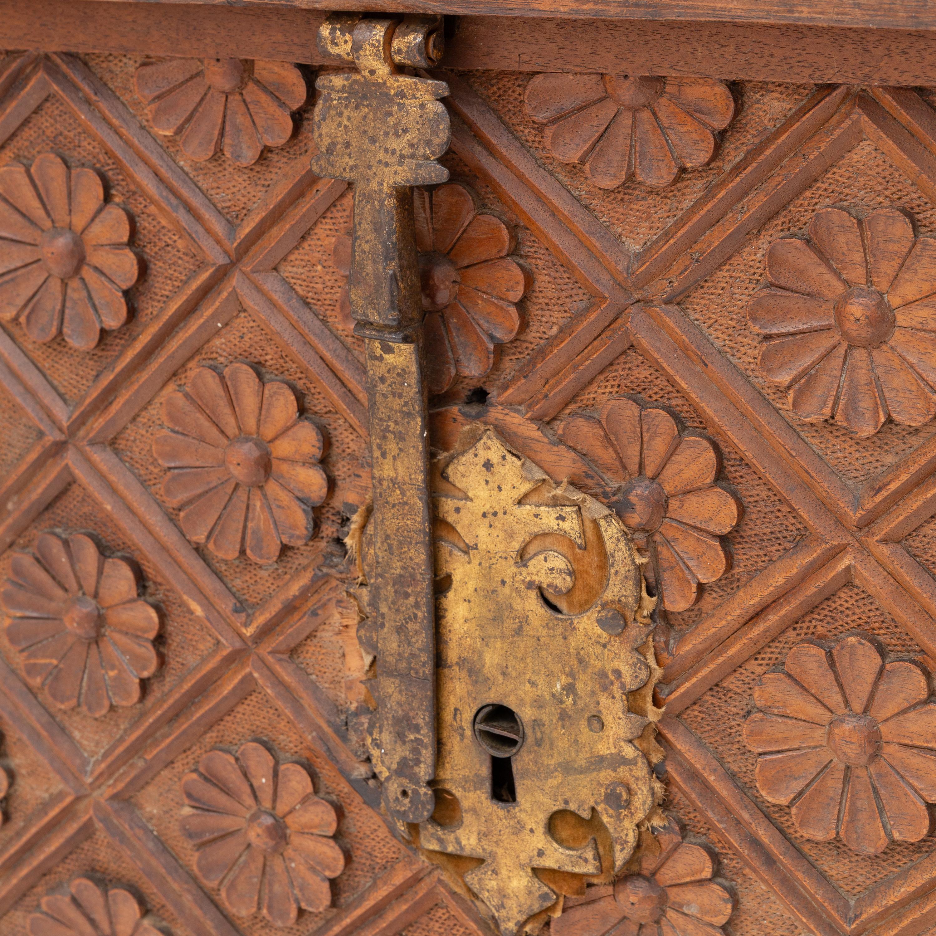A Spanish Carved Walnut and Gilt Iron Chest