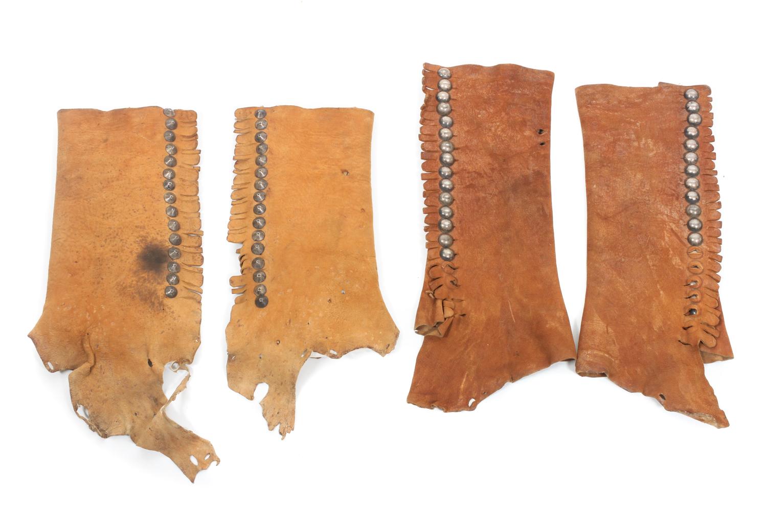 Two Pairs of Navajo Deer Skin Leggings Length of longer: 15 1/2 inches.